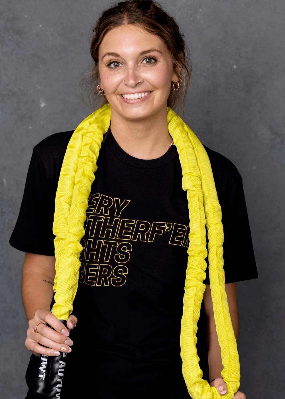 Excellent workout tee. We sell as many to women as we do to men. Good looking block font in yellow/gold ink on a dep black cotton t-shirt. 